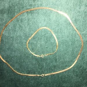 Gold colored necklace and bracket chains